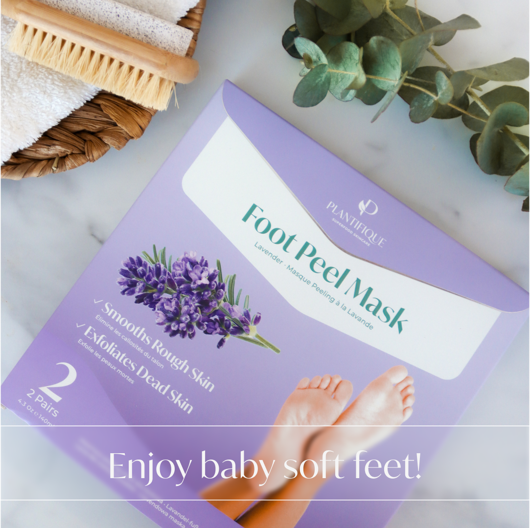 Lavender Foot Peel Mask from Plantifique on a table next to a foot brush