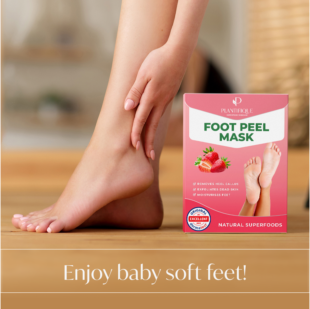 Hand touching soft feet after using the Plantifique Foot Peel Mask